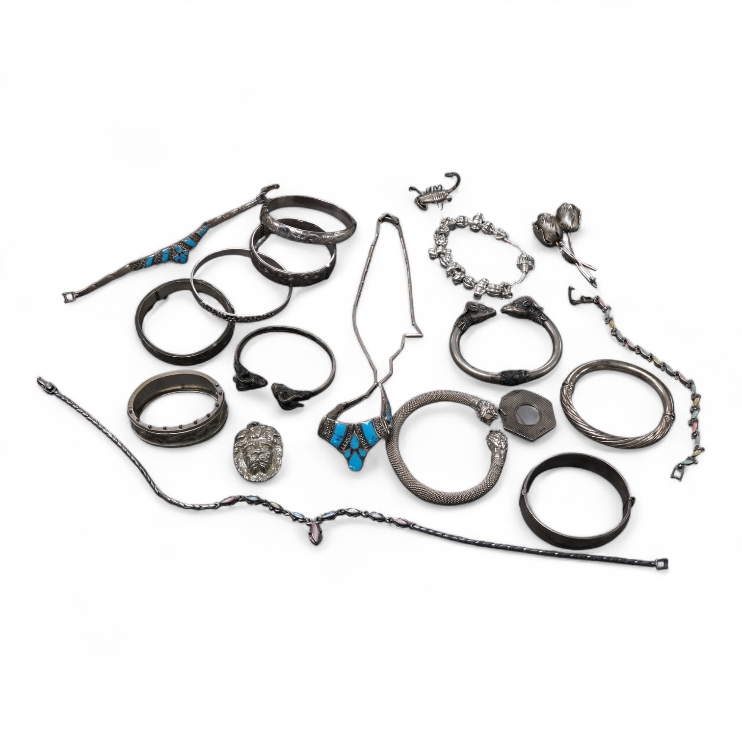 A group of assorted jewellery, including silver and white metal hinged bangles, a 1960's silver mounted cigar cutter by Ramsden & Roed, 925 necklaces and bracelet, etc.